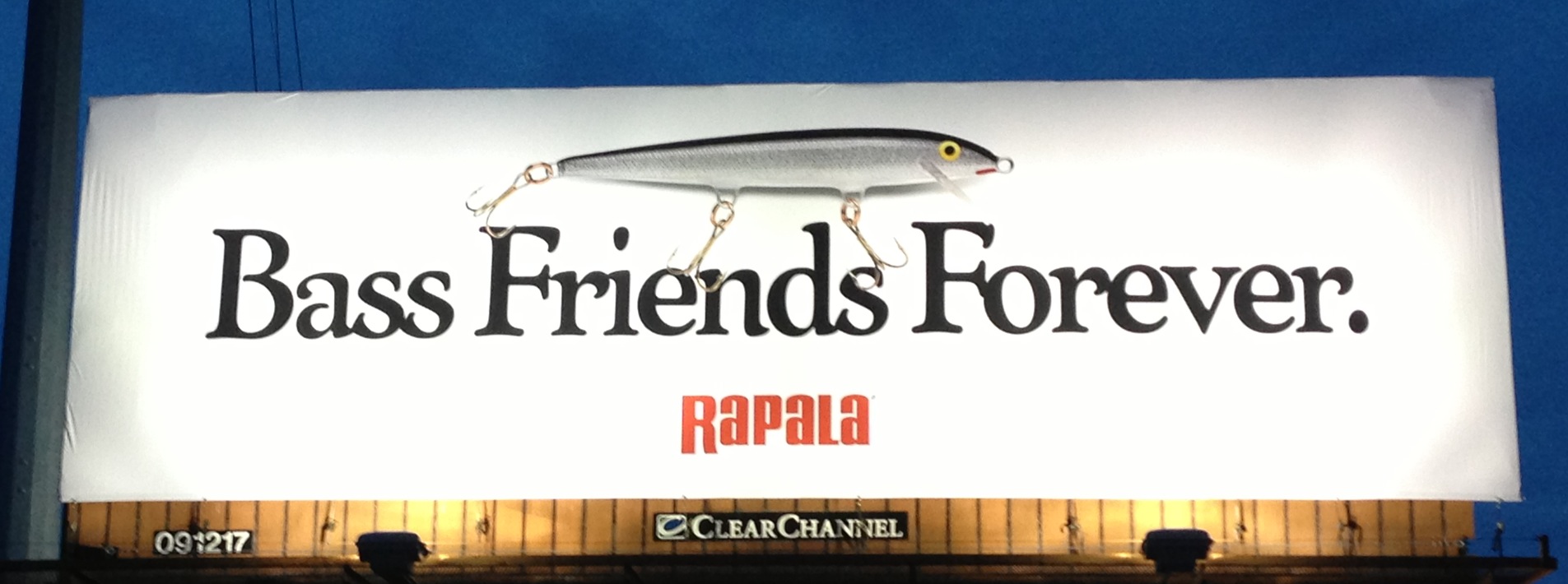 Billboard with a fish pun, "Bass Friends Forever"