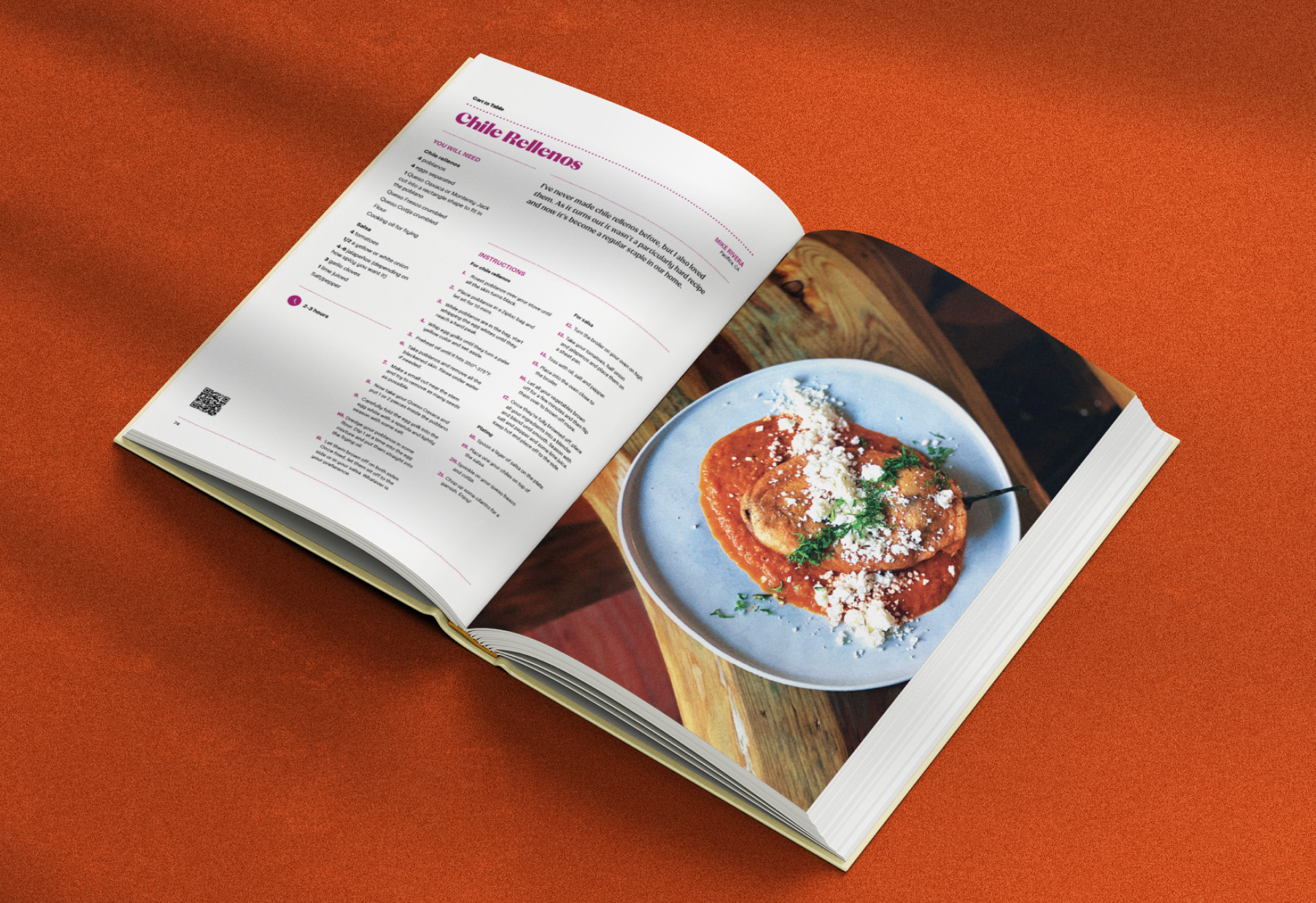 An open cookbook on a wooden surface displays a recipe for "Chile Rellenos" on the left page and a plated serving of the dish on the right page.