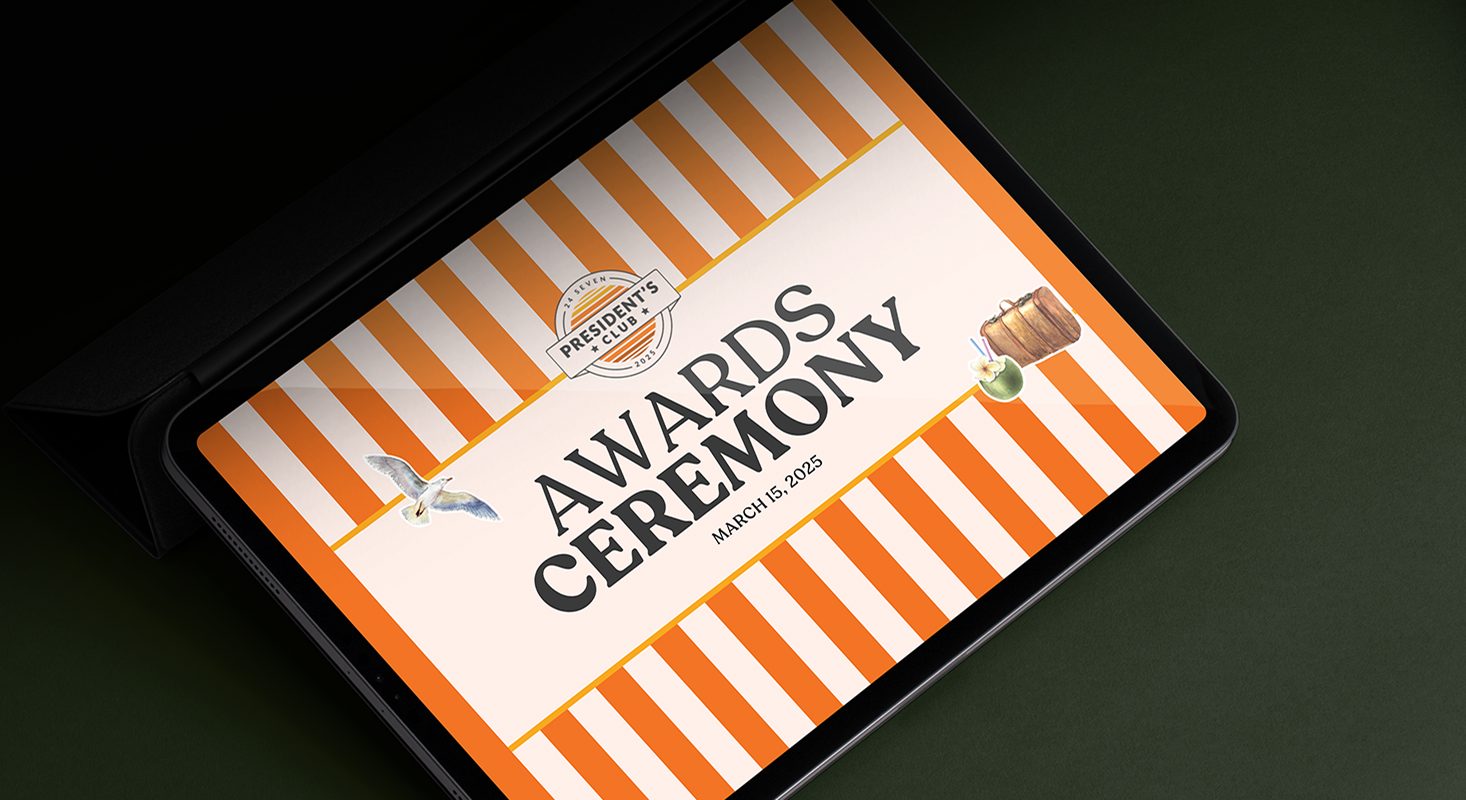 A tablet displays a digital flyer for the President’s Awards Ceremony, dated March 15, 2023, with orange stripes and images of a gavel and a seagull, celebrating excellence and honoring President's Club achievements.
