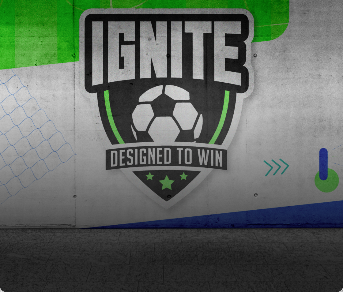 A wall mural displays a soccer-themed shield with the word "IGNITE" above a soccer ball and the phrase "DESIGNED TO WIN," surrounded by green and blue graphic elements that celebrate team spirit and dynamic design.