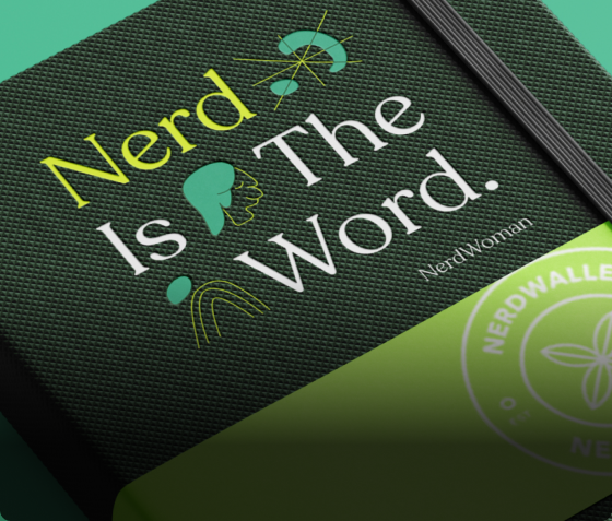 A textured notebook cover reads "Nerd Is The Word." in stylized text with abstract green graphics and the name "NerdWoman" below. A green item with the NerdWallet logo is partially visible, adding a touch of finance flair to this human-inspired design.