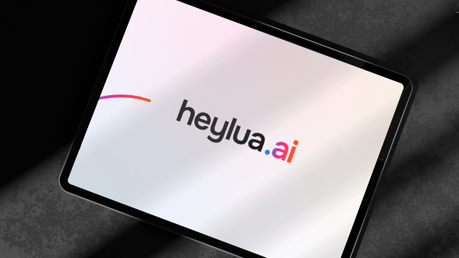 Tablet displaying the Heylua.ai logo on a light background, with partial shadow across the screen—highlighting the innovation of personal AI from Lua AI.