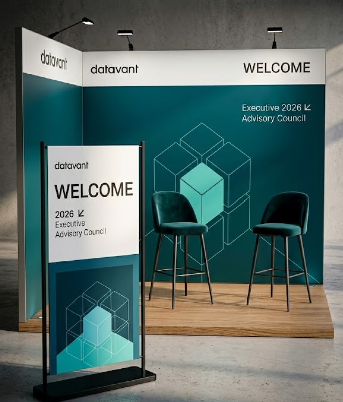 Exhibit booth with Datavant branding, two chairs, and signage reading "WELCOME 2026 Executive Advisory Council" against a geometric teal background, offering a unified executive experience.