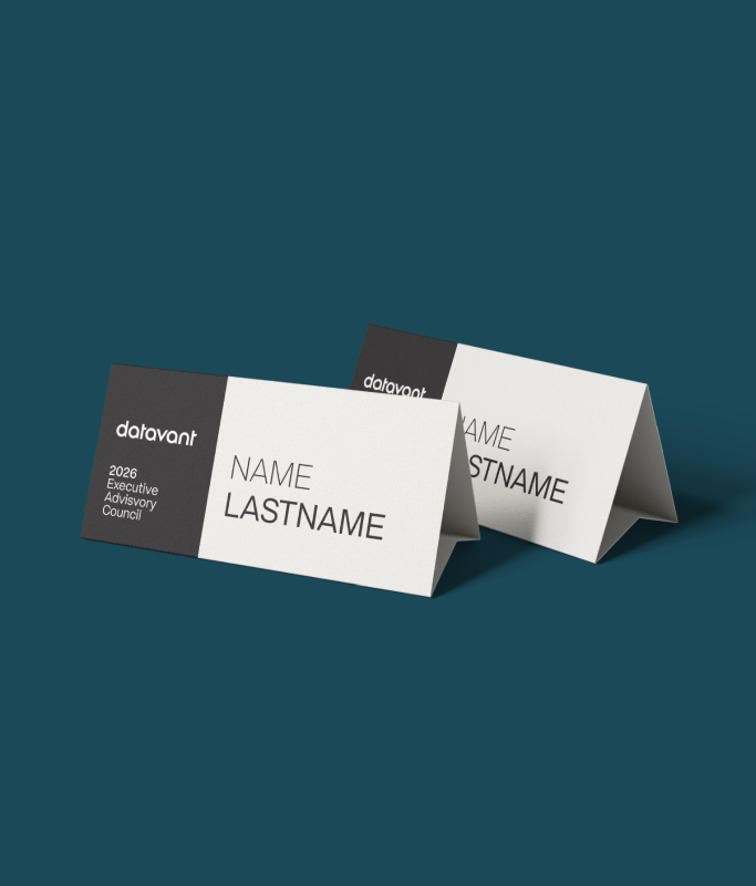 Two white and black tent-style name cards on a teal surface, each labeled "NAME LASTNAME" with "2026 Executive Advisory Council" and the Datavant logo, reflecting a premium executive experience.