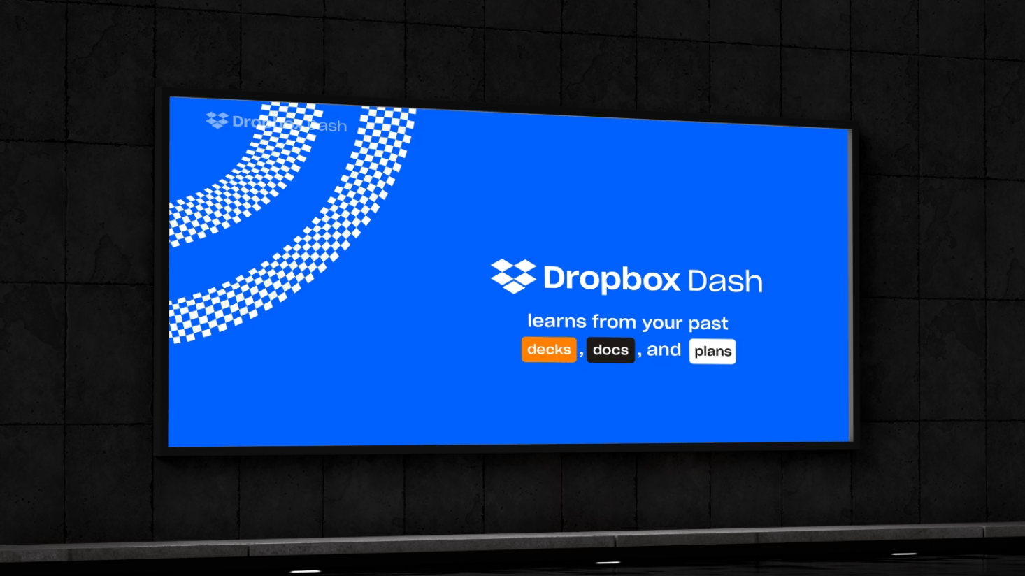 A blue billboard displays the Dropbox Dash logo and the text: "Dropbox Dash uses AI to learn from your past decks, docs, and plans," with each keyword highlighted in a colored box.